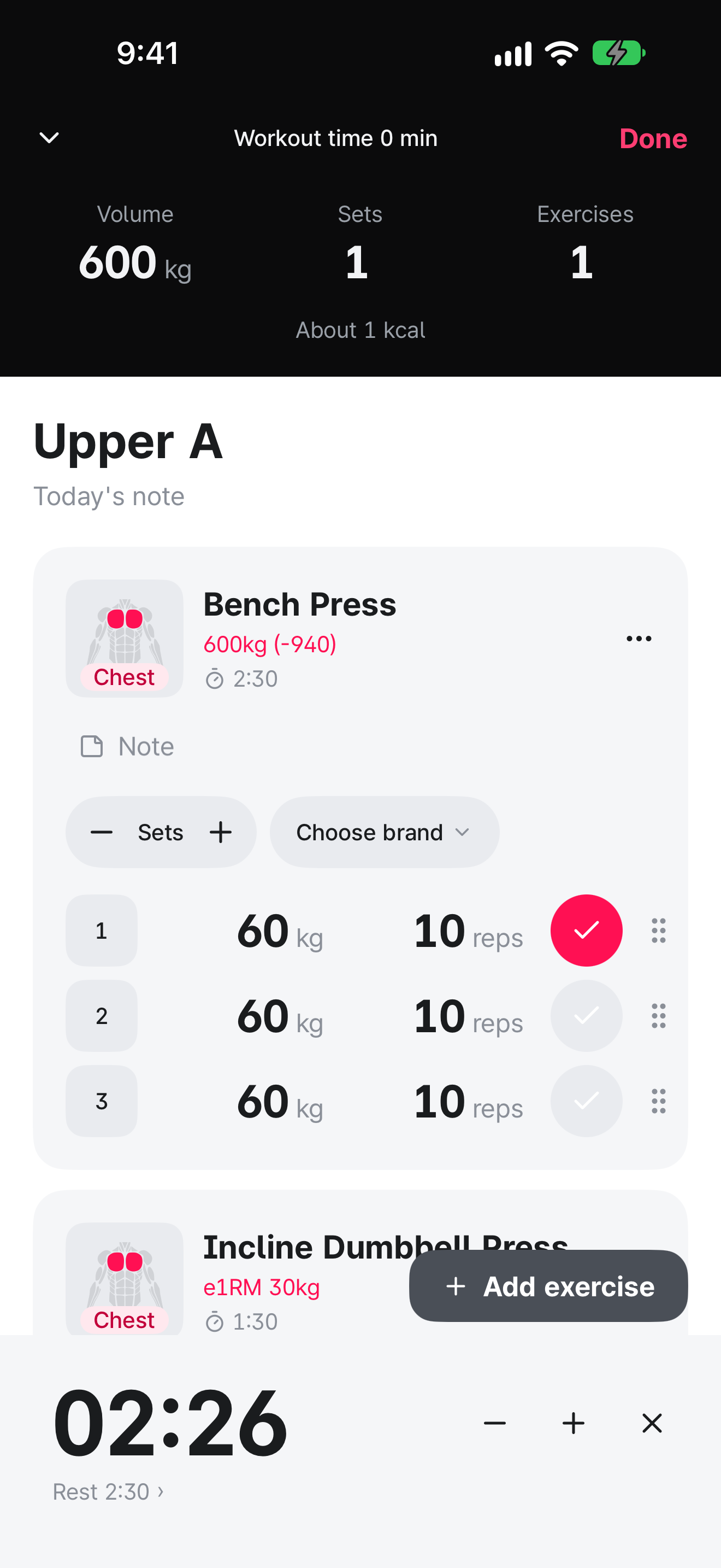 Workout screen. The first set has a red check mark, and a rest timer showing 2 minutes 26 seconds sits at the bottom.